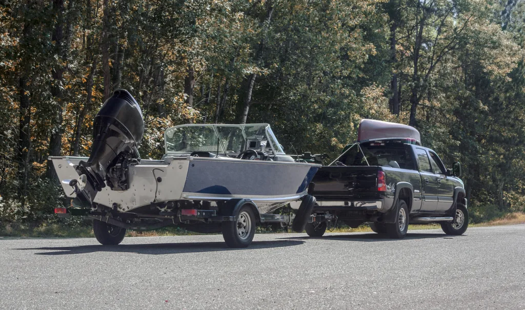 Truck with boat trailer.